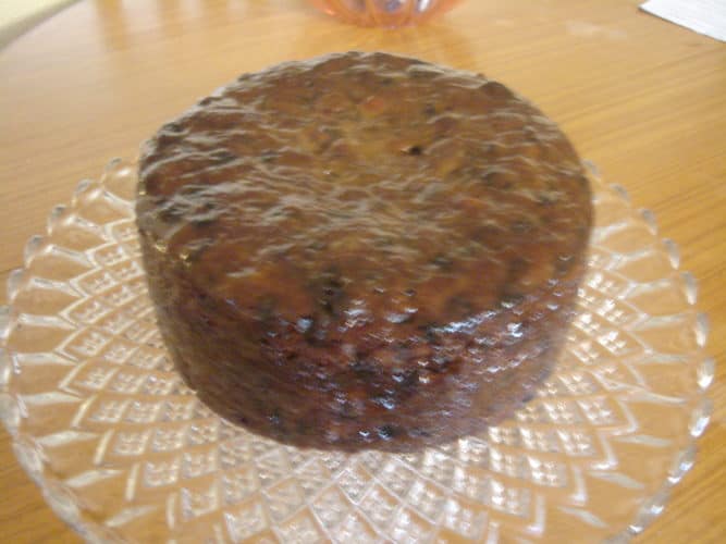 Fruit cake glazed with apricot preserve