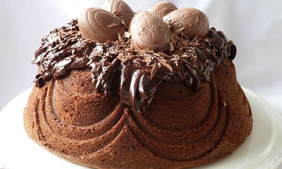 Chocolate Bundt cake topped with ganache and chocolate eggs