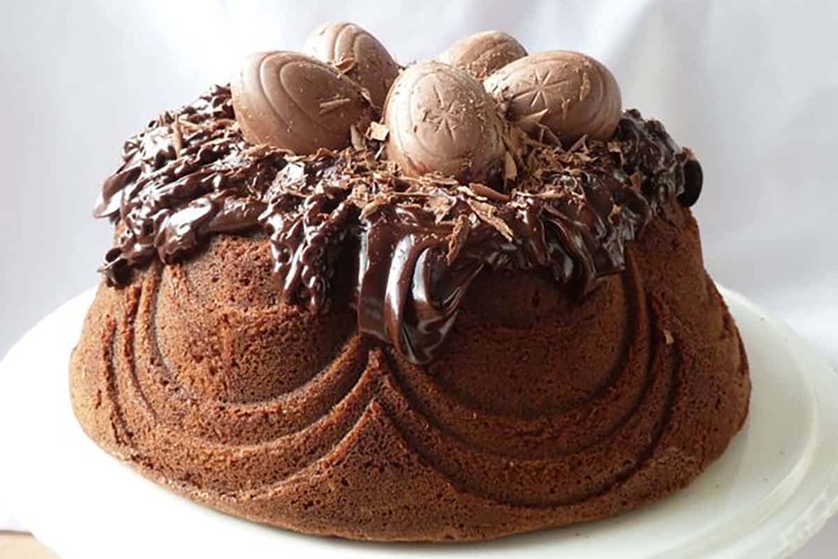 Chocolate Bundt cake topped with ganache and chocolate eggs