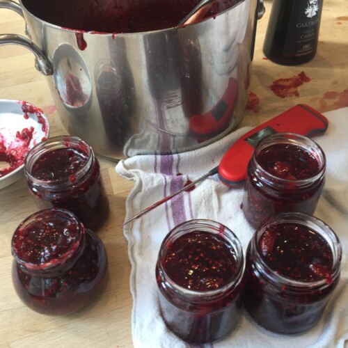 Jars of jam and a large preserving pot