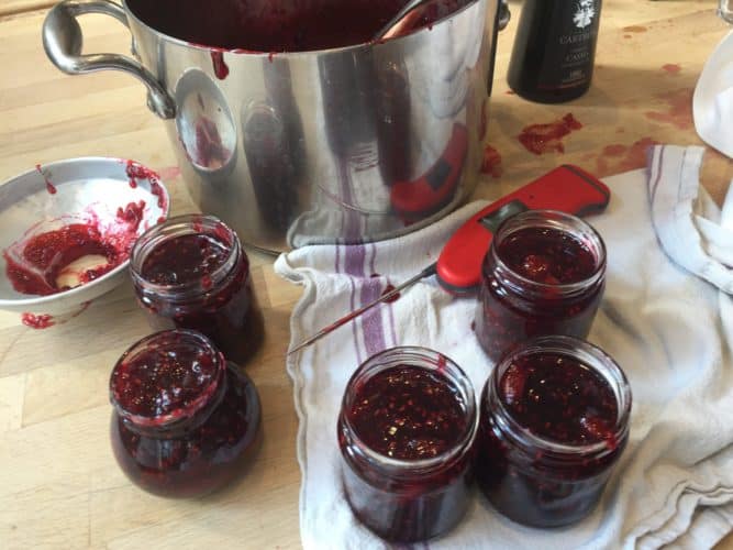 Jars of jam and a large preserving pot