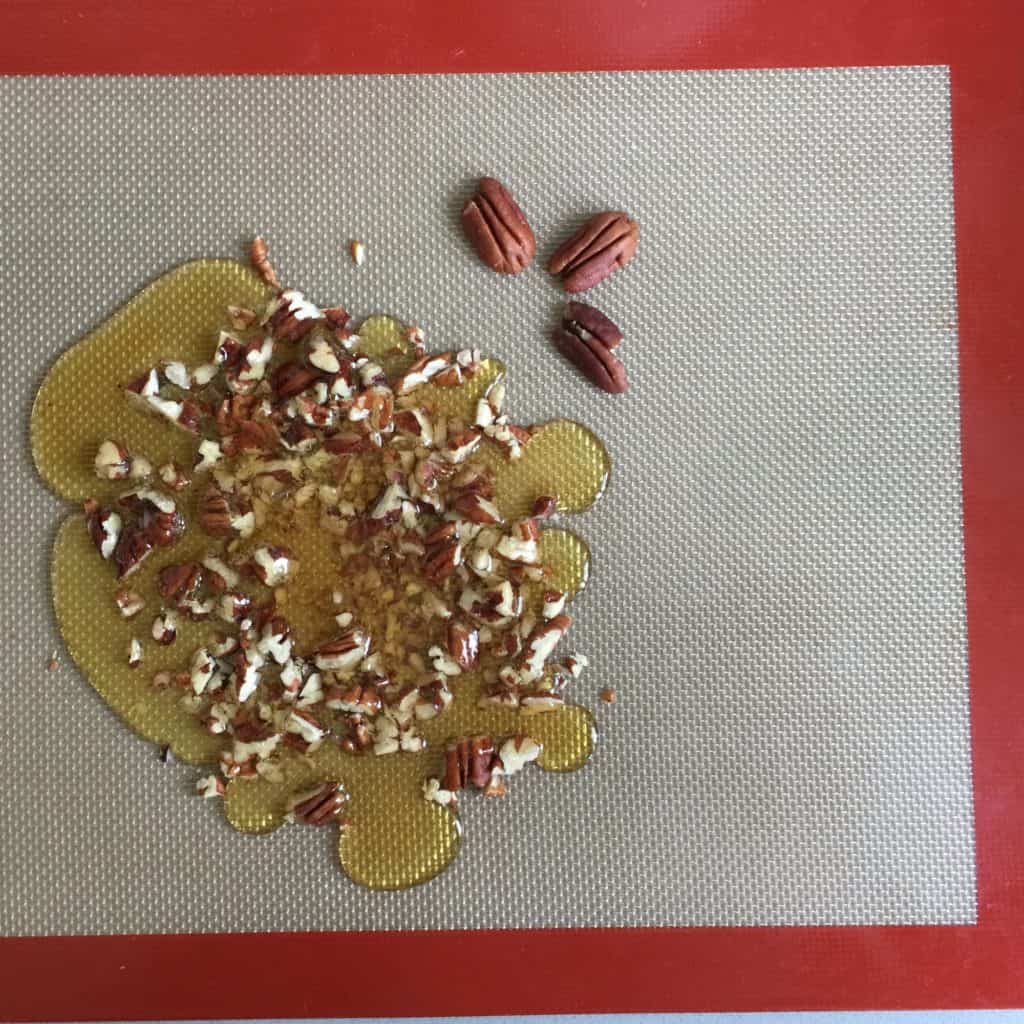 Caramel Pecan Brittle on a silicone baking sheete