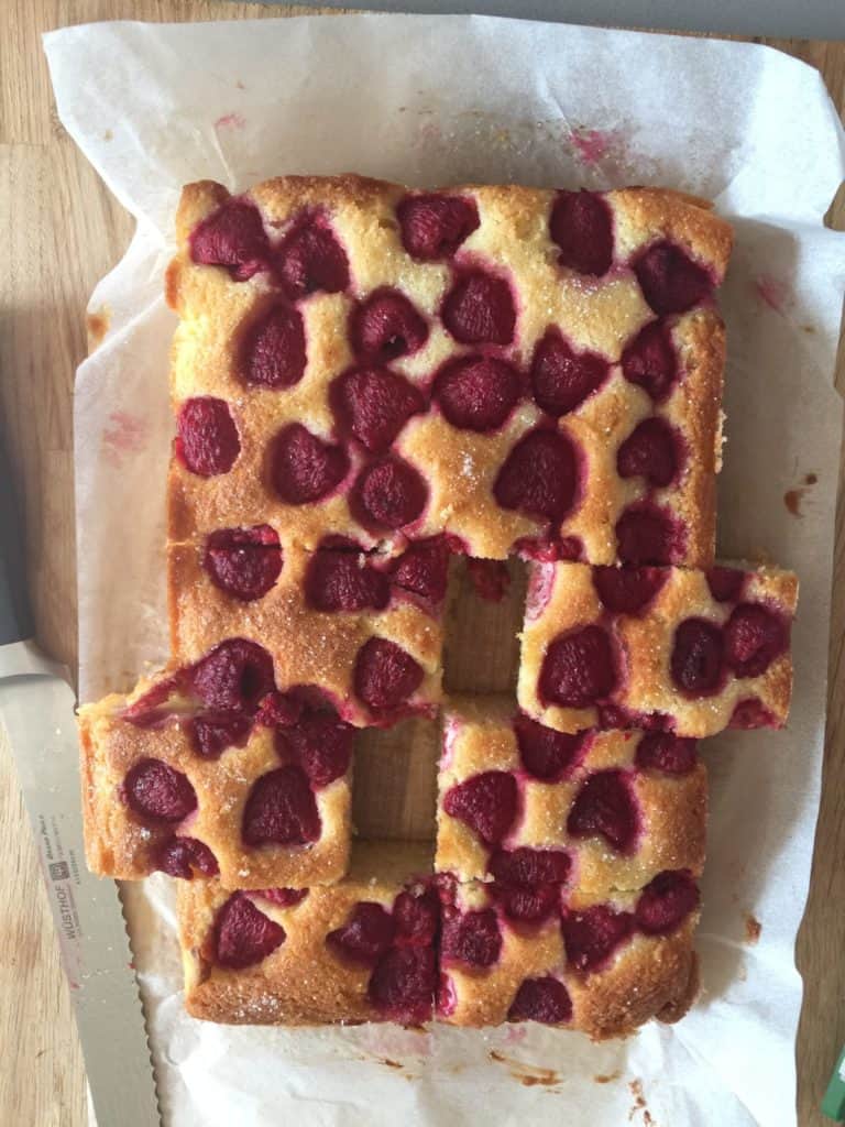 Raspberry and Almond Traybake with slices cut out