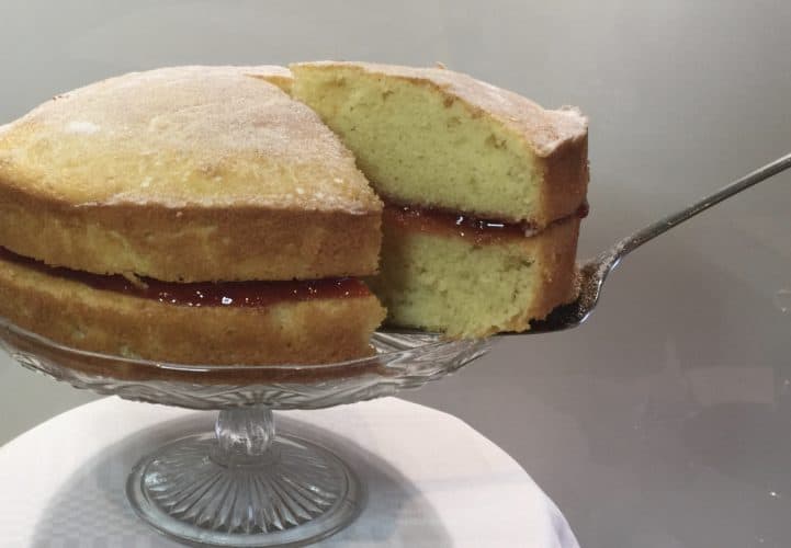 Victoria Sponge cake on a glass cake stand