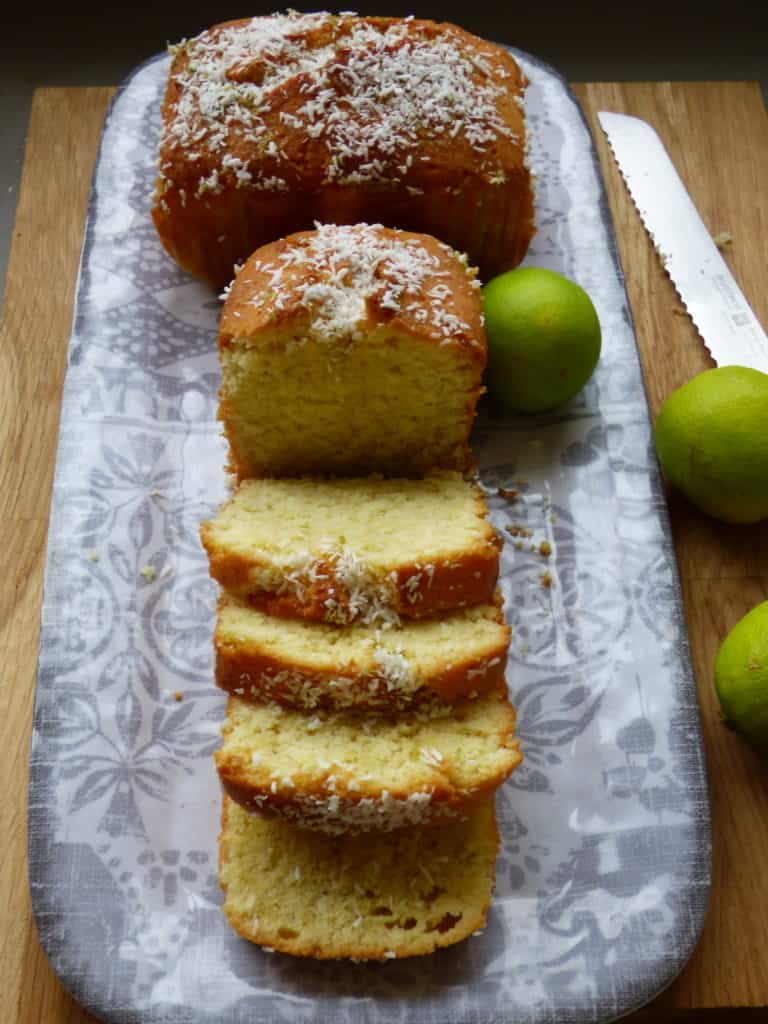 Coconut and Lime loaves. Sliced on a grey pattered plate.