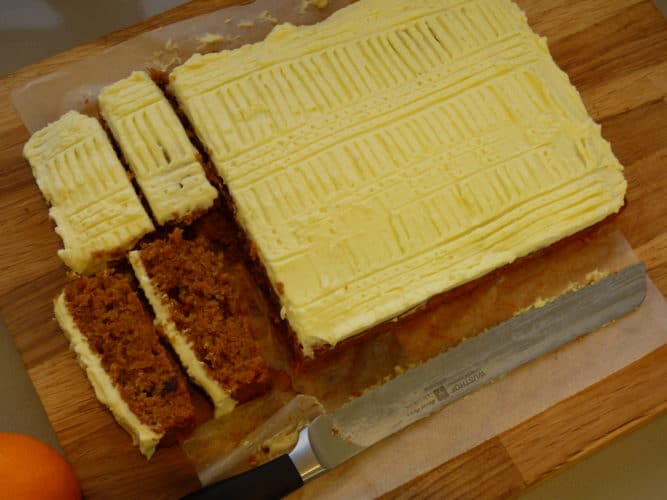 Olive Oil, Carrot and Raisin Cake with a cream cheese frosted topping.