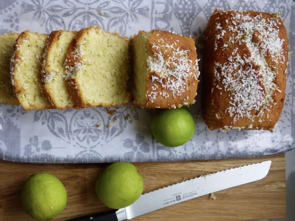 Coconut and Lime loaves. Sliced on a grey pattered plate.