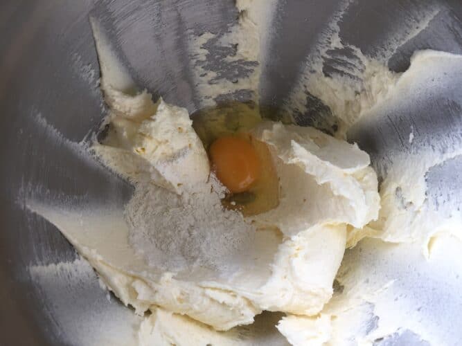 Sugar butter eggs and flour in a mixing bowl