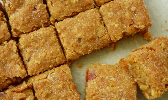 Cherry, Oat and White Chocolate Cookie Bars cut into small square slices