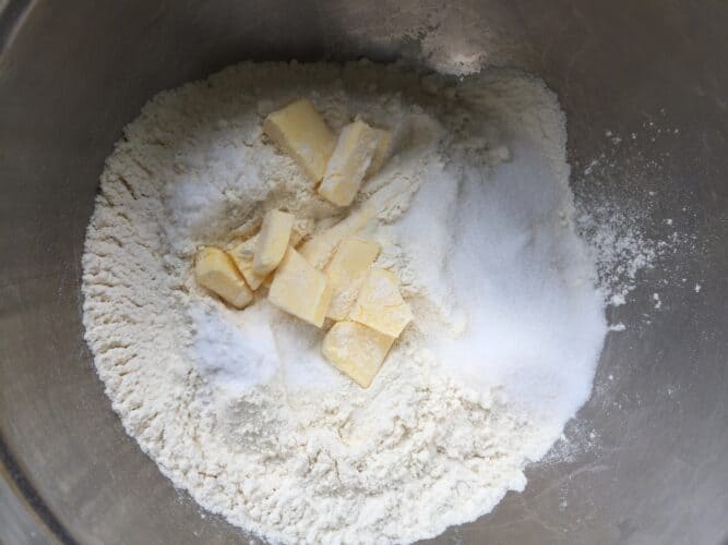 cubed butter, flour, sugar in a bowl