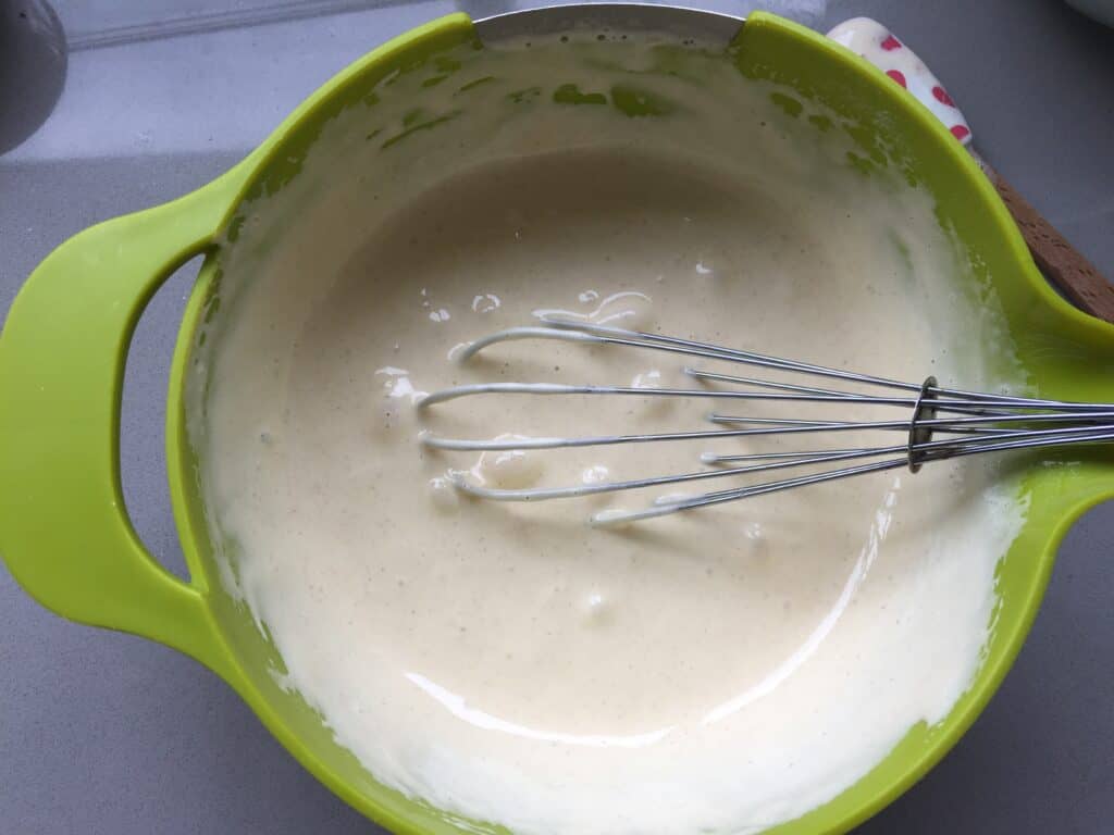 cake batter in a green bowl.