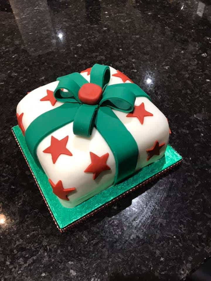 Fondant covered cake made to look like a wrapped christmas present