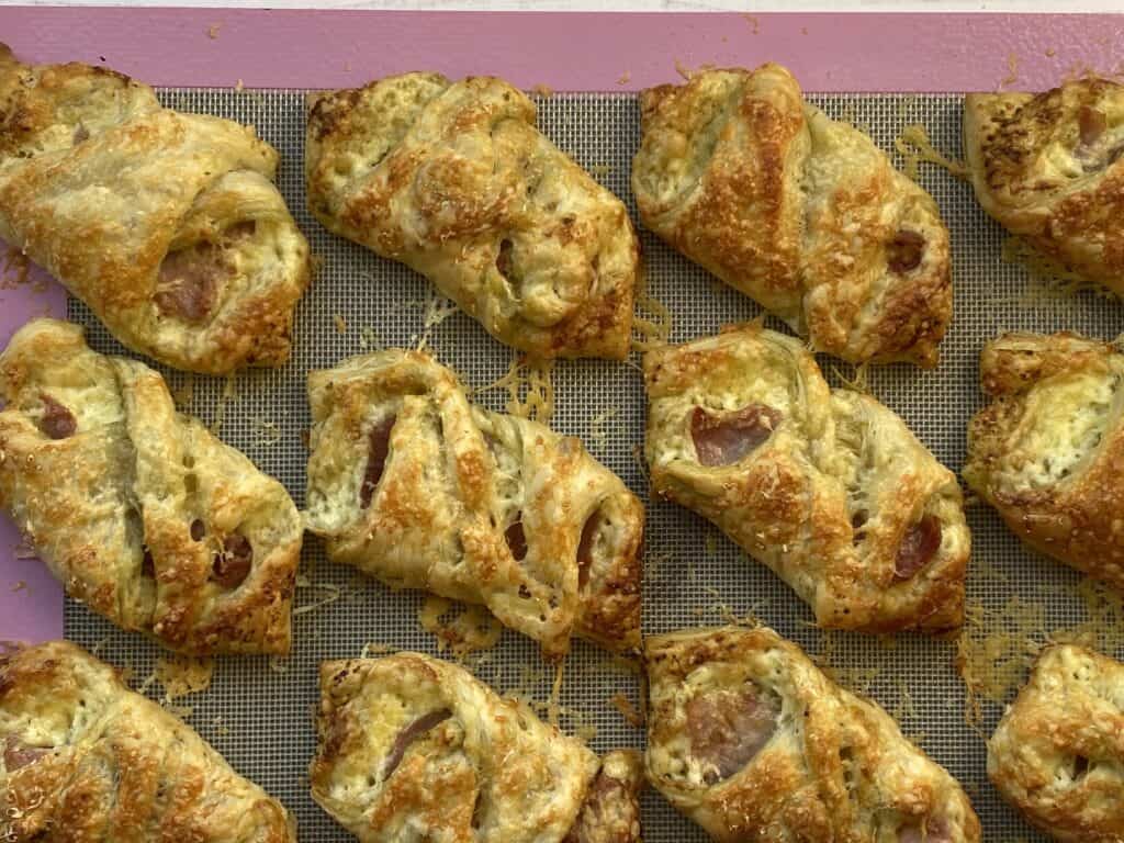 Cooked Puff Pasty Bacon snack on a baking sheet