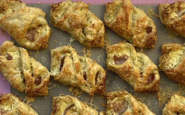 Cooked Puff Pasty Bacon snack on a baking sheet
