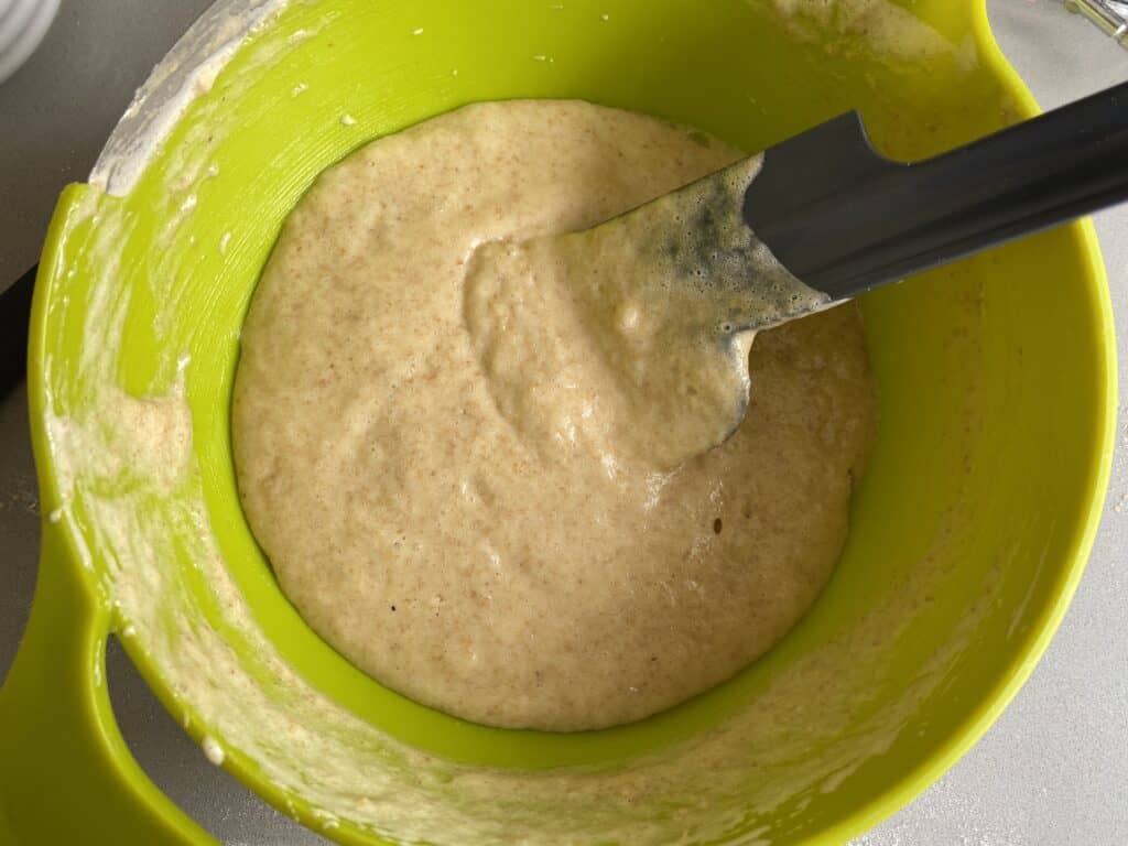 Cake batter in a green bowl
