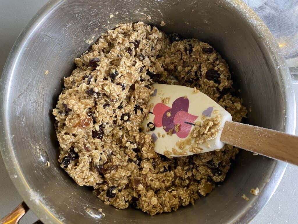 Flapjack dough mixture in a pan with a spatular