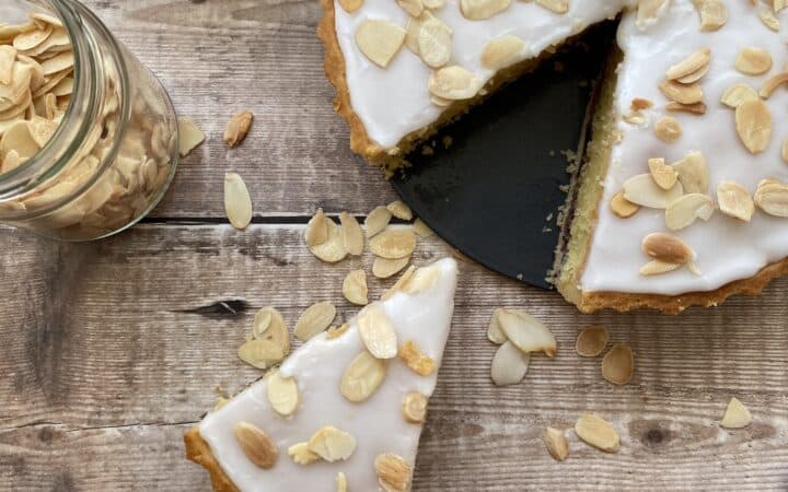 Overhead shot of Bakewell Tart with a slice cut out