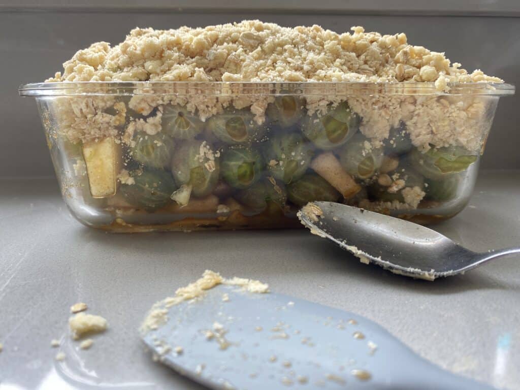 Gooseberry and Apple Crumble in a clear dish