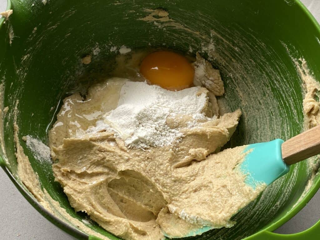 Cake ingredients in a green bowl