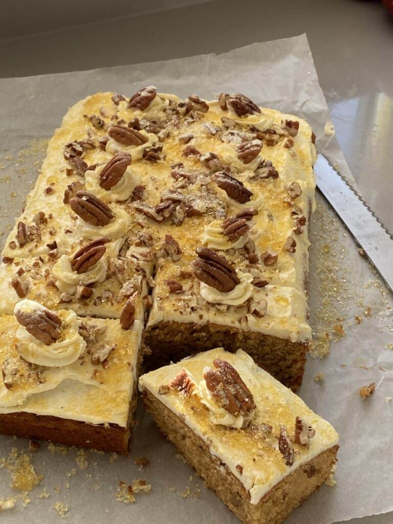 Pecan Cake with a slice cut out.