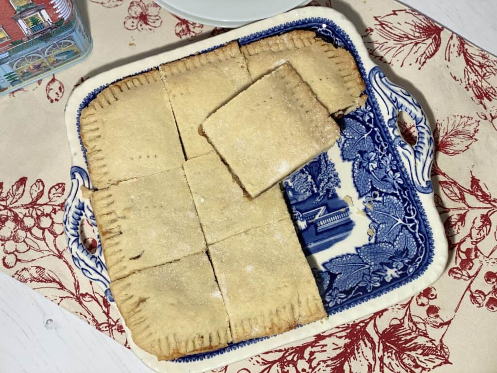 MIncemeat tart cut into squares on a blue patterned plate